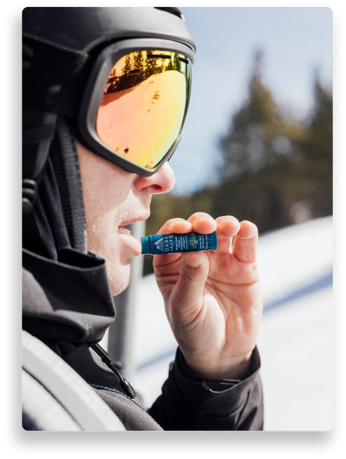 man using lip balm with spf