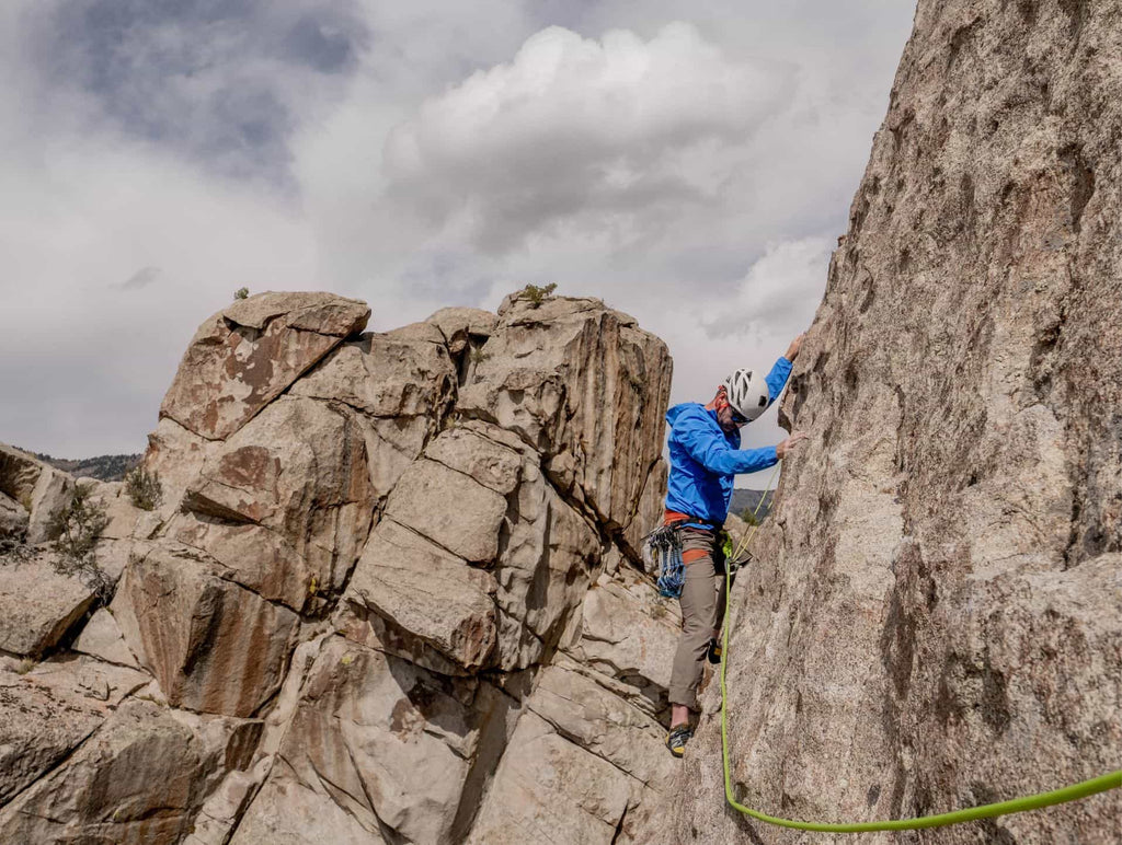 Matt Walker climbing a rock face