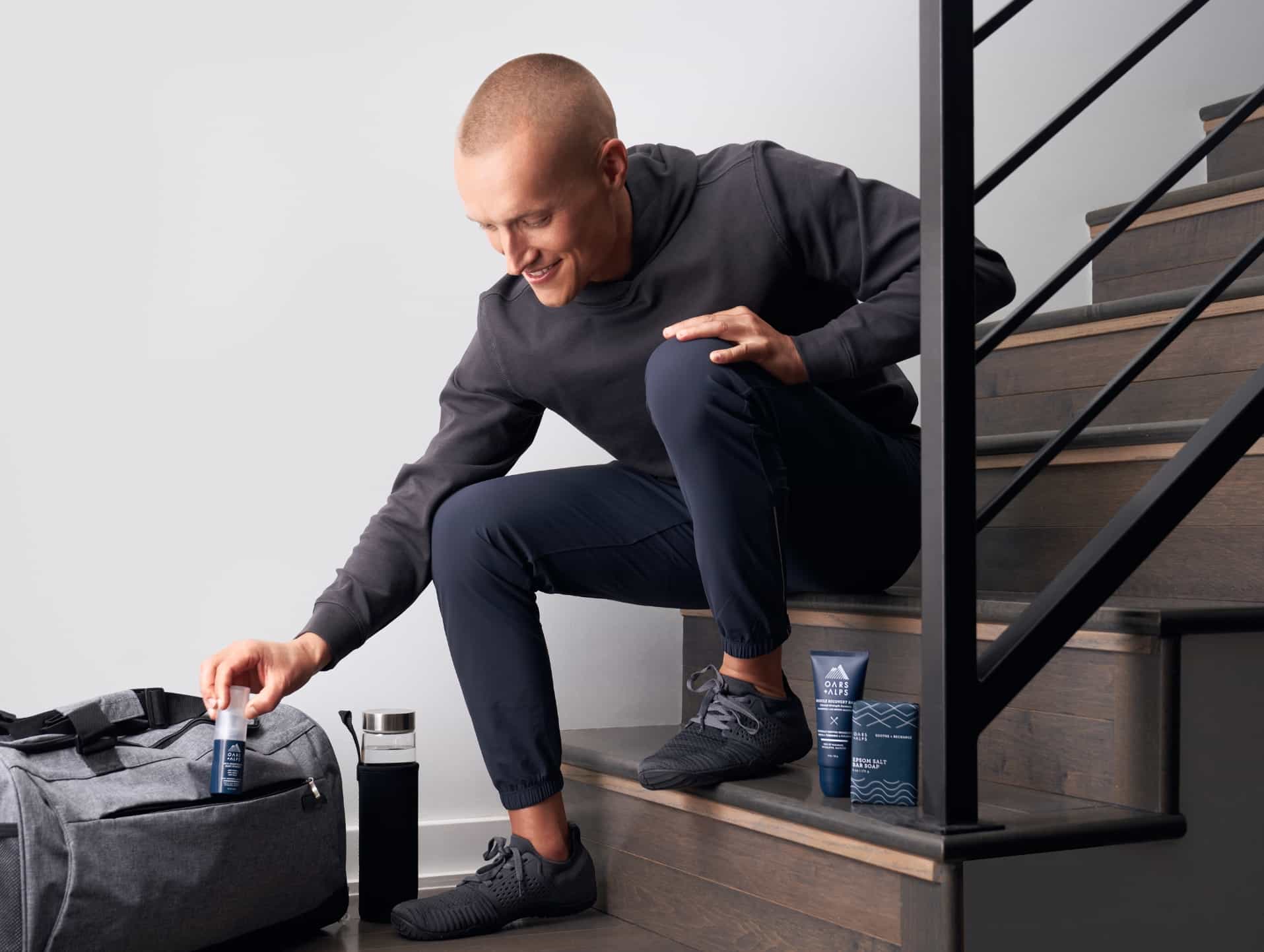 Matt Wilpers putting athlete line products in gym bag